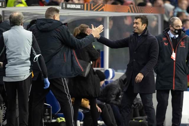 Giovanni van Bronckhorst celebrates at full time after qualifying for the knock-out stages of the UEFA Europa League. (Photo by Alan Harvey / SNS Group)
