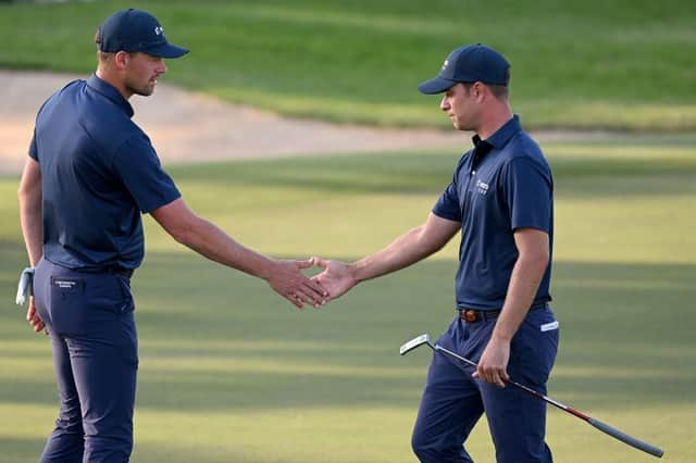 Continental Europe duo Guido Migliozzi and Victor Perez shake hands after beating Seamus Power and Bob MacIntyre in the Saturday afternoon foursomes session. Picture: Ross Kinnaird/Getty Images.