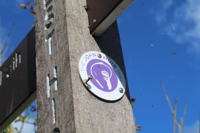 The 134-mile John Muir Way is marked by signposts bearing images of the eponymous Dunbar-born naturalist