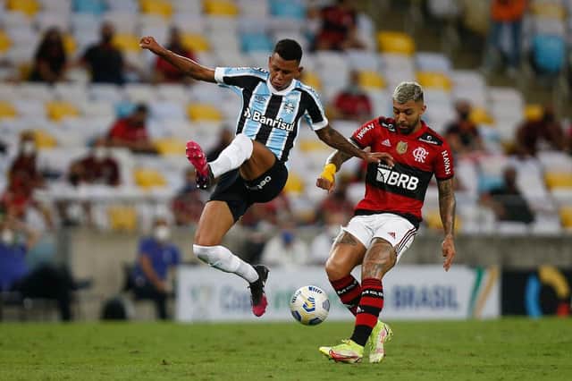 Fernando Henrique, left, fighting for possession in Copa Do Brasil clash between Gremio and Flamengo. Picture: Getty