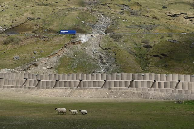 A83 traffic will be diverted onto the Old Military Road below which is partially protected by a 6m-high bund. Picture: John Devlin