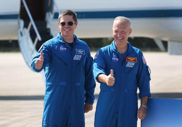 NASA astronauts Bob Behnken (left) and Doug Hurley (right) pose for the media after arriving at the Kennedy Space Centre (Photo: Joe Raedle/Getty Images)