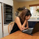 A woman showing signs of depression. The biggest impact of dramatically falling living standards is yet to hit, according to new research that shows families across the UK have only experienced half of the lost income they are expected to suffer during the cost-of-living crisis. Picture: Anna Gowthorpe/PA Wire