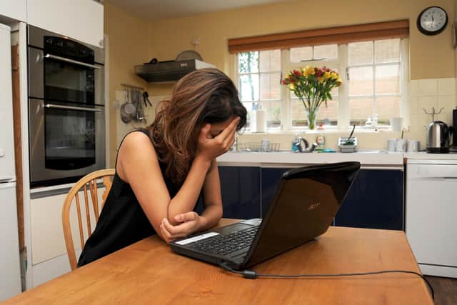 A woman showing signs of depression. The biggest impact of dramatically falling living standards is yet to hit, according to new research that shows families across the UK have only experienced half of the lost income they are expected to suffer during the cost-of-living crisis. Picture: Anna Gowthorpe/PA Wire