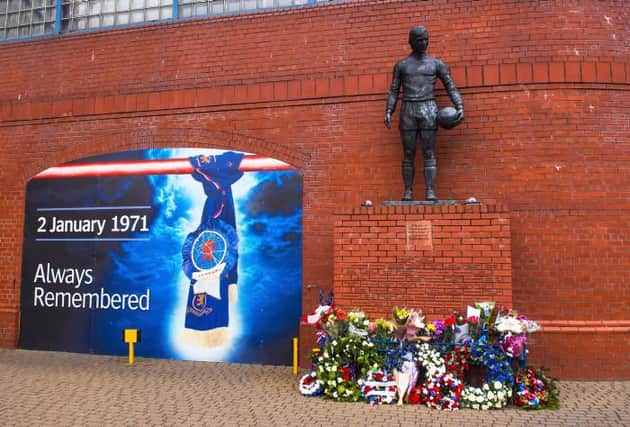 The statue of John Greig at the memorial outside Ibrox Stadium to the 66 supporters who lost their lives in the disaster on January 2, 1971. (Photo by Gary Hutchison, SNS Group).