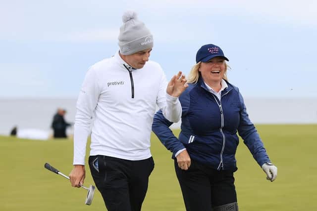 Matt Fitzpatrick walks with mum and playing partner Sue at Kingsbarns in the second round of the Alfred Dunhill Links Championship. Picture: Stephen Pond/Getty Images.