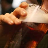 File photo dated 01/12/06 of a man drinking a pint of beer, as campaigners are urging people to show compassion towards those who have lost someone due to alcohol or other drugs in an effort to reduce the stigma associated with alcohol-related deaths.