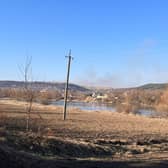 Smoke rising on the Ukrainian side of the border was an artillery strike, according to locals.