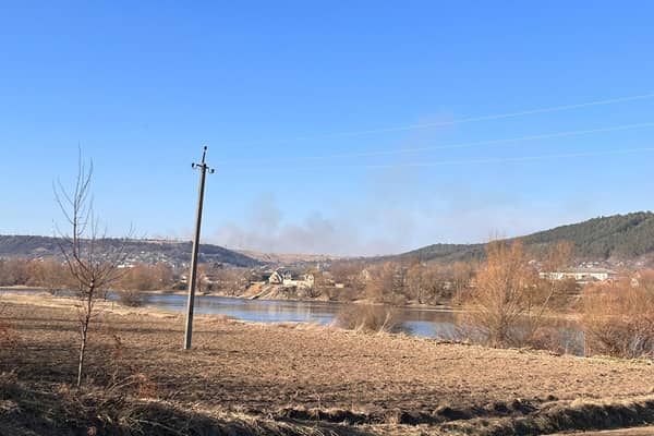 Smoke rising on the Ukrainian side of the border was an artillery strike, according to locals.