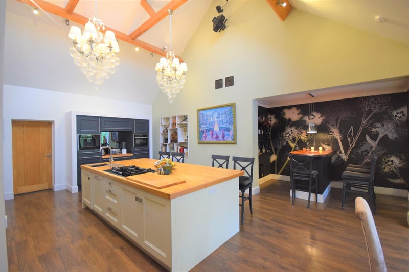 The stunning kitchen with vaulted ceiling and a large three-metre central breakfast island unit.