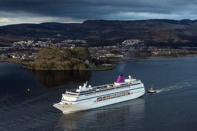 MS Ambition passes Dumbarton Rock after leaving Glasgow. The ship was chartered to provide temporary accommodation for those fleeing conflict in Ukraine.