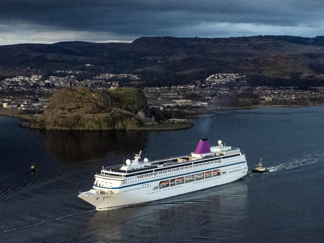 MS Ambition passes Dumbarton Rock after leaving Glasgow. The ship was chartered to provide temporary accommodation for those fleeing conflict in Ukraine.