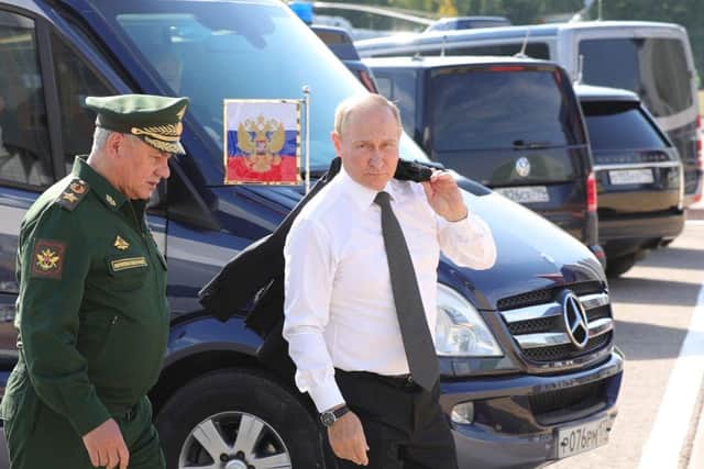 Russian President Vladimir Putin  and Defence Minister Sergei Shoigui, pictured in August.