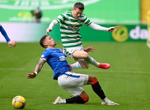 Celtic's Callum McGregor, here challenged by James Tavernier , has pleaded with supporters to "stay together" (Photo by Rob Casey / SNS Group)