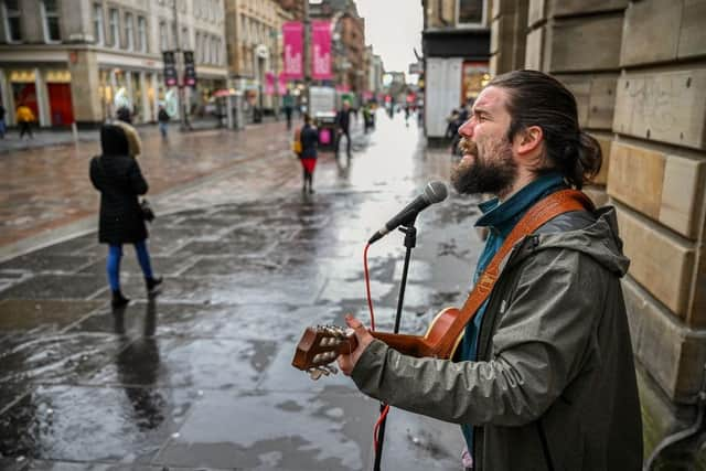 Glasgow commuters walk along Buchanan Street.