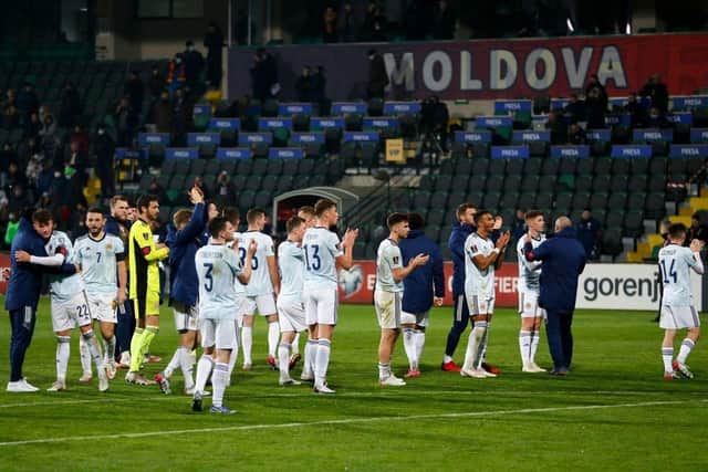 Scotland's players celebrate after the FIFA World Cup Qatar 2022 qualification football match between Moldova and Scotland at Chisinau's Zimbru Stadium on November 12, 2021.(Photo by BOGDAN TUDOR/AFP via Getty Images)
