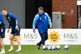 Scotland assistant John Carver oversees training at Lesser Hampden.