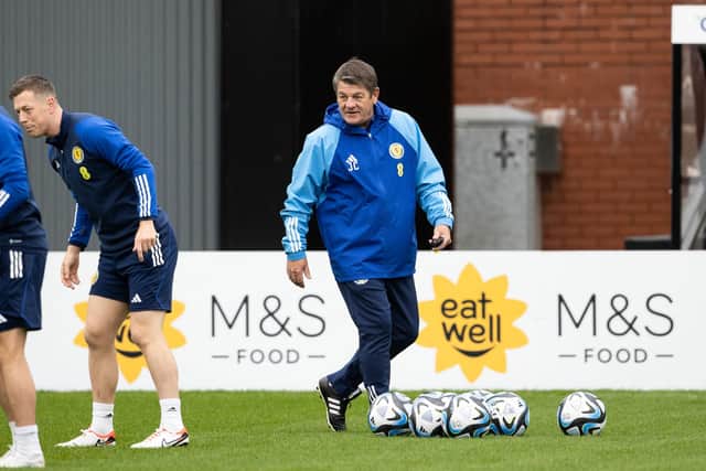 Scotland assistant John Carver oversees training at Lesser Hampden.