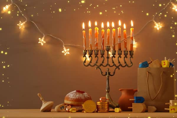 The Menorah holds nine candles, eight of which are lit using the ninth throughout the festival. Photo: tomertu / Getty Images /Canva Pro