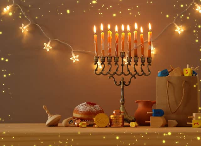 The Menorah holds nine candles, eight of which are lit using the ninth throughout the festival. Photo: tomertu / Getty Images /Canva Pro