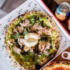 Burrata and speck pizza