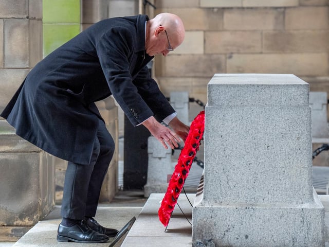 First Minister John Swinney lays a wreath during the Remembrance Sunday ceremony