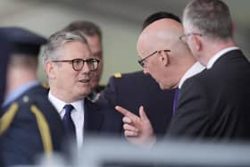 Labour leader Sir Keir Starmer (left) speaks to SNP First Minister John Swinney (Photo by Andrew Matthews/PA Wire)