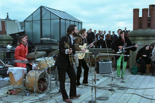 Up on the roof ... The Beatles in their last-ever performance, revived for Peter Jackson's epic Get Back documentary
