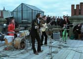 Up on the roof ... The Beatles in their last-ever performance, revived for Peter Jackson's epic Get Back documentary