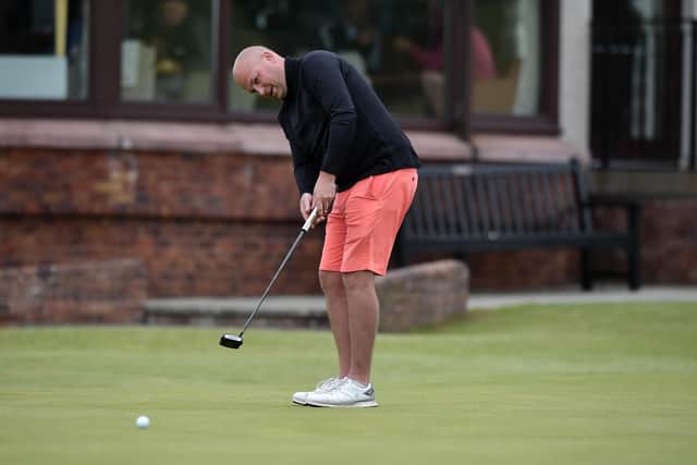 Kilmacolm's Matthew Clark putts on the 18th green during the second qualifying round in the R&A Amateur Championship at Nairn. Picture: Charles McQuillan/R&A/R&A via Getty Images.