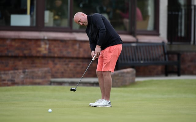 Kilmacolm's Matthew Clark putts on the 18th green during the second qualifying round in the R&A Amateur Championship at Nairn. Picture: Charles McQuillan/R&A/R&A via Getty Images.