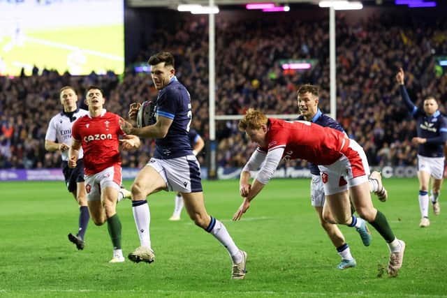 Blair Kinghorn breaks free to score another try for Scotland.