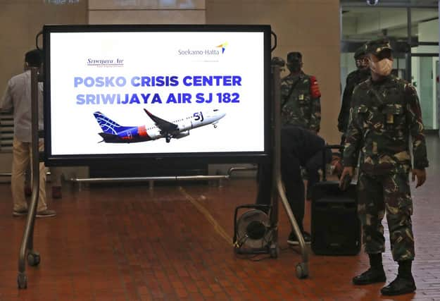 Indonesian soldiers at a crisis centre set up at Jakarta Airport after the flight went missing. Picture: Tatan Syuflana/AP