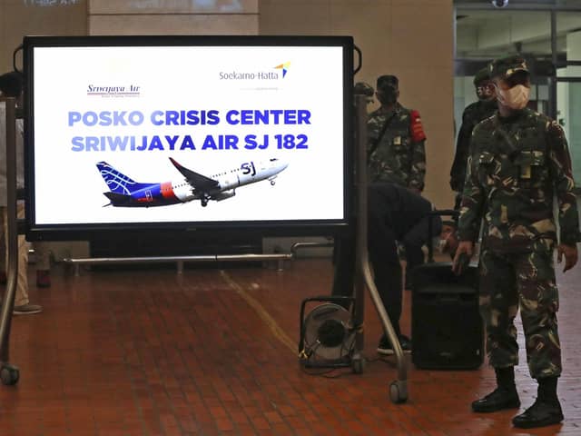 Indonesian soldiers at a crisis centre set up at Jakarta Airport after the flight went missing. Picture: Tatan Syuflana/AP