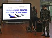 Indonesian soldiers at a crisis centre set up at Jakarta Airport after the flight went missing. Picture: Tatan Syuflana/AP