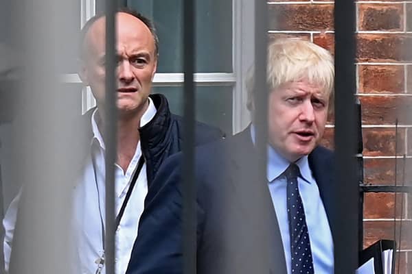 Britain's Prime Minister Boris Johnson (right) and his former special advisor Dominic Cummings leave from the rear of Downing Street in central London. The photo was taken on September 3, 2019, while Mr Cummings was still in post. Picture: Daniel Leal/AFP via Getty Images