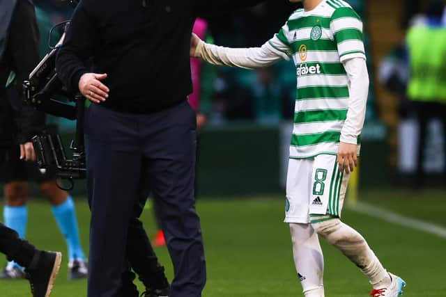 Celtic manager Ange Postecoglou congratulates Kyogo Furuhashi as he leaves the field after his goal that set the Parkhead side up for their 2-0 victory over Ferencvaros. (Photo by Craig Williamson / SNS Group)