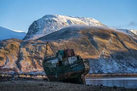 Ben Nevis looms over the wreck of the Golden Harvest fishing boat on the banks of Loch Linnhe near Fort William in the western Highlands. Picture: Jane Barlow/PA Wire