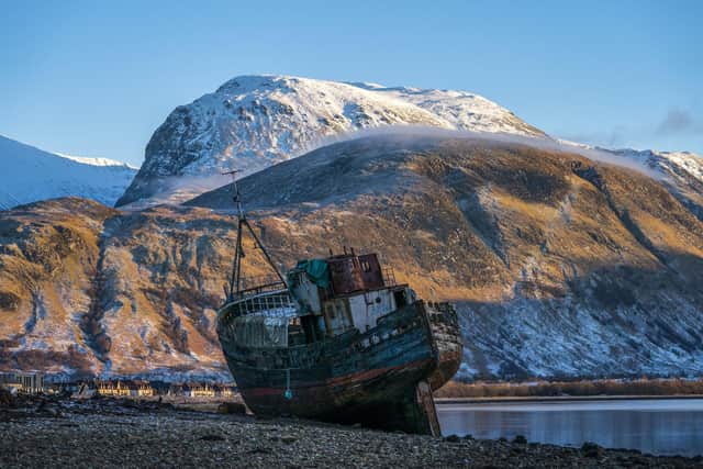 Ben Nevis looms over the wreck of the Golden Harvest fishing boat on the banks of Loch Linnhe near Fort William in the western Highlands. Picture: Jane Barlow/PA Wire