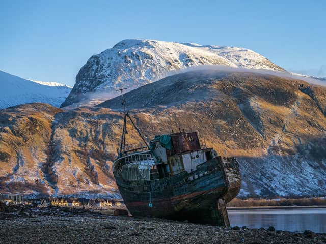 Ben Nevis looms over the wreck of the Golden Harvest fishing boat on the banks of Loch Linnhe near Fort William in the western Highlands. Picture: Jane Barlow/PA Wire