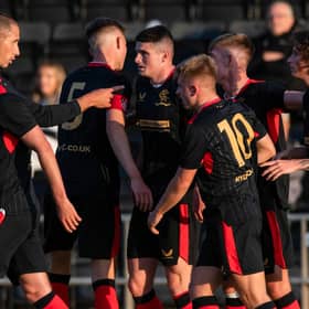 Nikola Katic, left, congratulates Jake Hastie after the latter's goal against Dumbarton