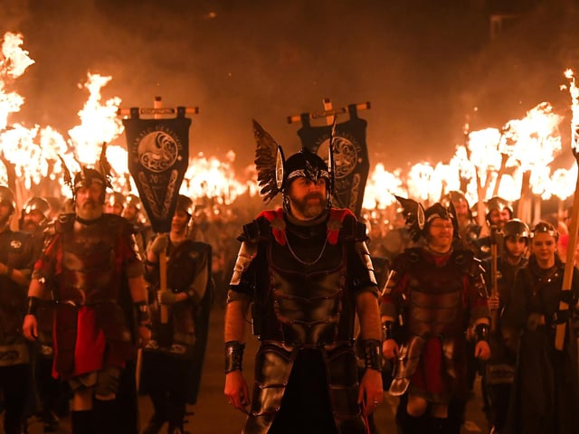 Members of the Up Helly Aa 'Jarl Squad', carrying flaming torches, parade through the streets of Lerwick in the Shetland Islands. Picture: Andy Buchanan/AFP via Getty Images