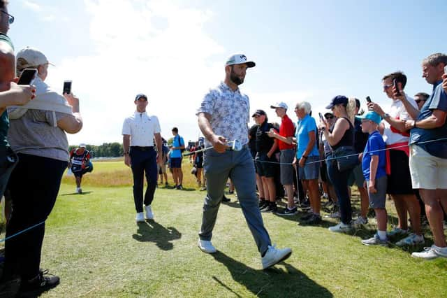 Jon Rahm and Rory McIlroy walk to a tee during the first round of the abrdn Scottish Open at The Renaissance Club. Picture: Luke Walker/Getty Images.