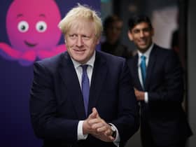Former prime minister Boris Johnson, flanked by his then-Chancellor Rishi Sunak. Picture: PA