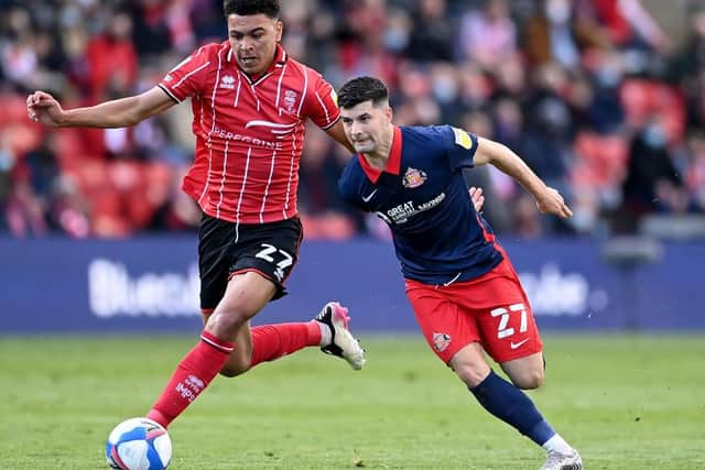 Jordan Jones of Sunderland battles for possession with Morgan Rogers of Lincoln City  during the Sky Bet League One Play-off Semi Final 1st Leg match between Lincoln City and Sunderland. (Photo by Laurence Griffiths/Getty Images)