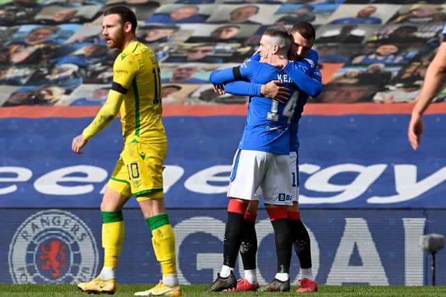 Rangers' Ryan Kent (right) celebrates what proved to be the winning goal in the Premiership match against Hibs at Ibrox. Photo by Rob Casey / SNS Group