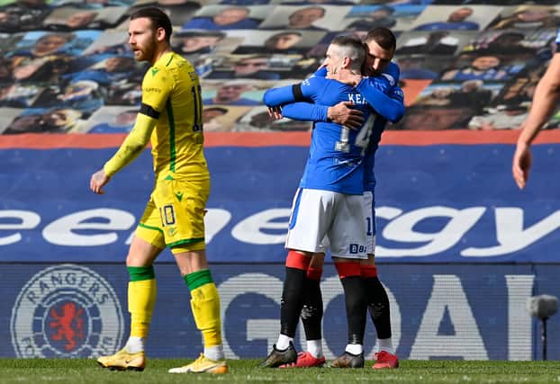 Rangers' Ryan Kent (right) celebrates what proved to be the winning goal in the Premiership match against Hibs at Ibrox. Photo by Rob Casey / SNS Group