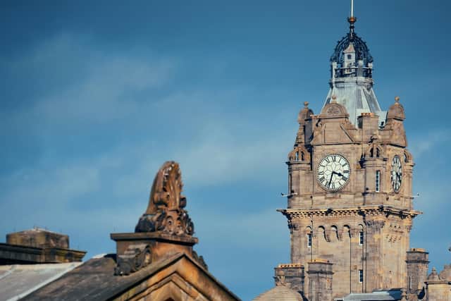 The Balmoral Hotel clock tower beyond the National Galleries of Scotland in Princes Street, Edinburgh. The Rocco Forte hotel is offering guests in-room Curfew Club activities to add to a capital experience.