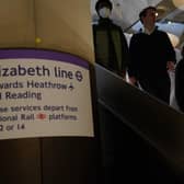 Passengers descend the escalators to the Elizabeth Line platforms at Paddington Station, London, as the new line opens to passengers for the first time.
