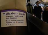 Passengers descend the escalators to the Elizabeth Line platforms at Paddington Station, London, as the new line opens to passengers for the first time.